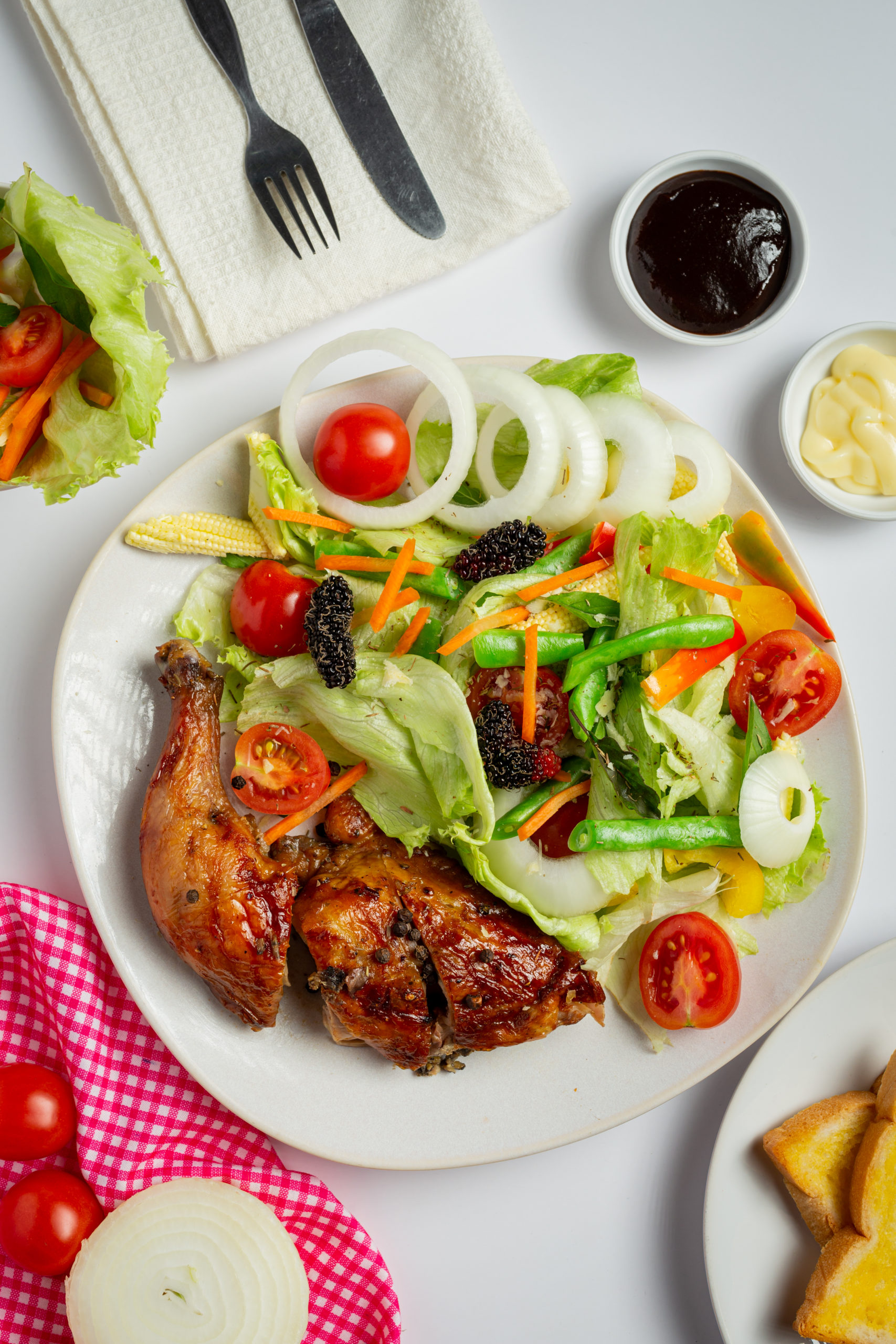 grilled chicken steak and vegetables on marble background